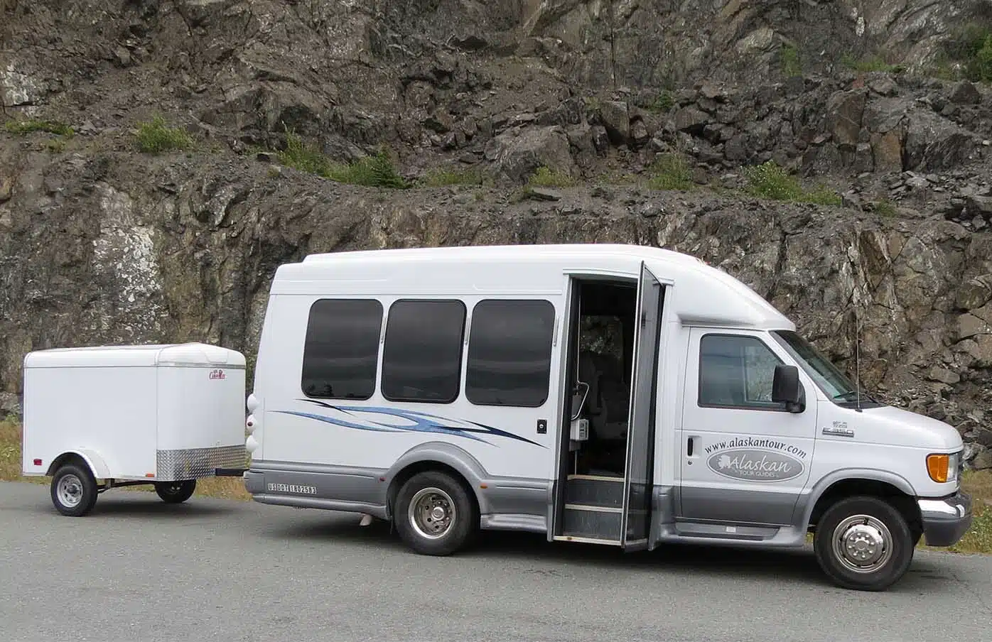 alaskan tour guides bus and luggage trailer